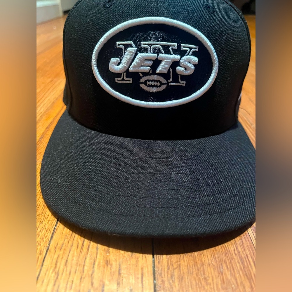 -Black Crown -Black Visor -Black Undervisor -NYJ Logo -100%Polyester -Adjustable